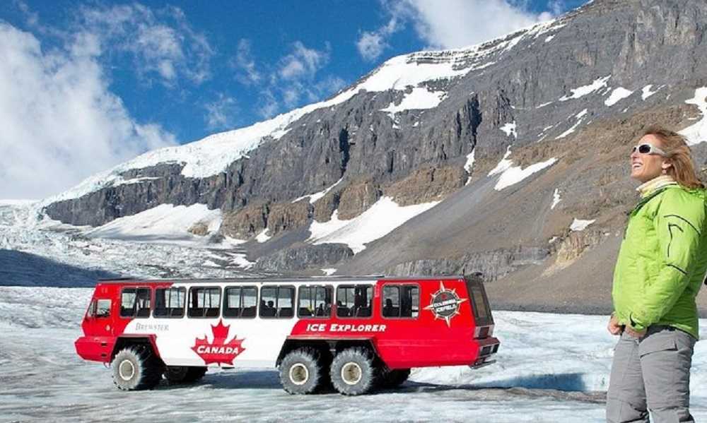 A woman explores a glacier during tours of Calgary.