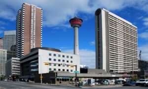 Best things to do in Calgary including a city street with tall buildings and a clock tower.