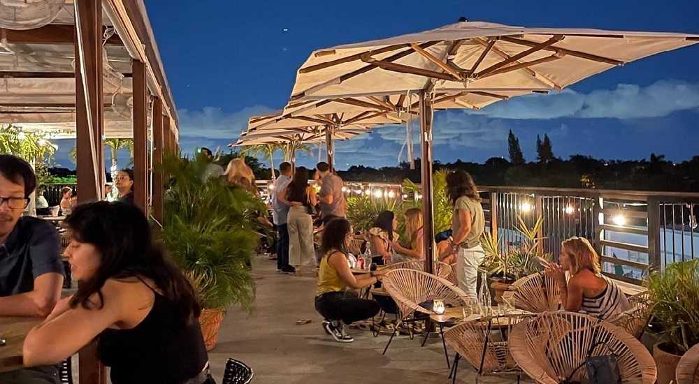 The Citadel Miami Restaurant: A group of people dining at the Citadel rooftop restaurants in Miami.