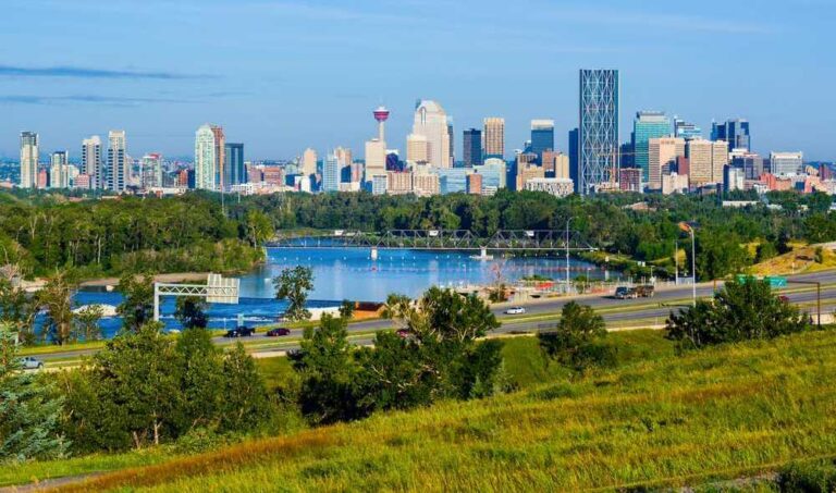 The skyline of Calgary with a river in the background, perfect for tours of Calgary.