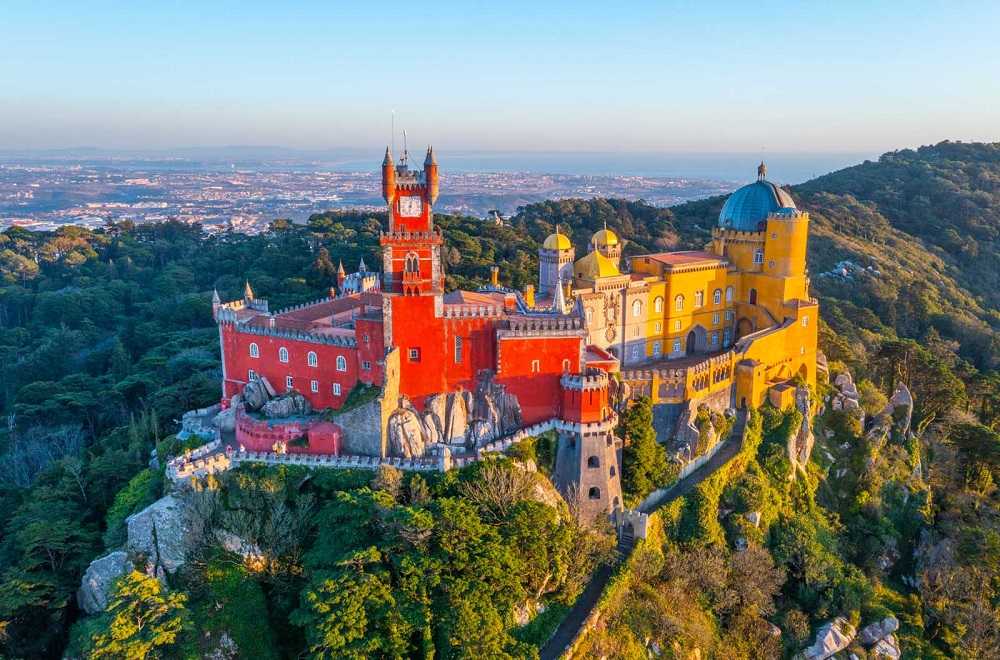 A castle sits on top of a mountain in Sintra, Lisbon, Portugal, offering one of the best things to do in Lisbon.