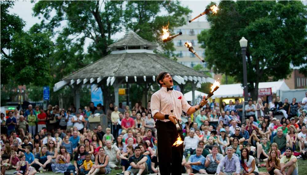 A man mesmerizes the crowd by performing a thrilling fire act at one of the electrifying festivals in Edmonton.