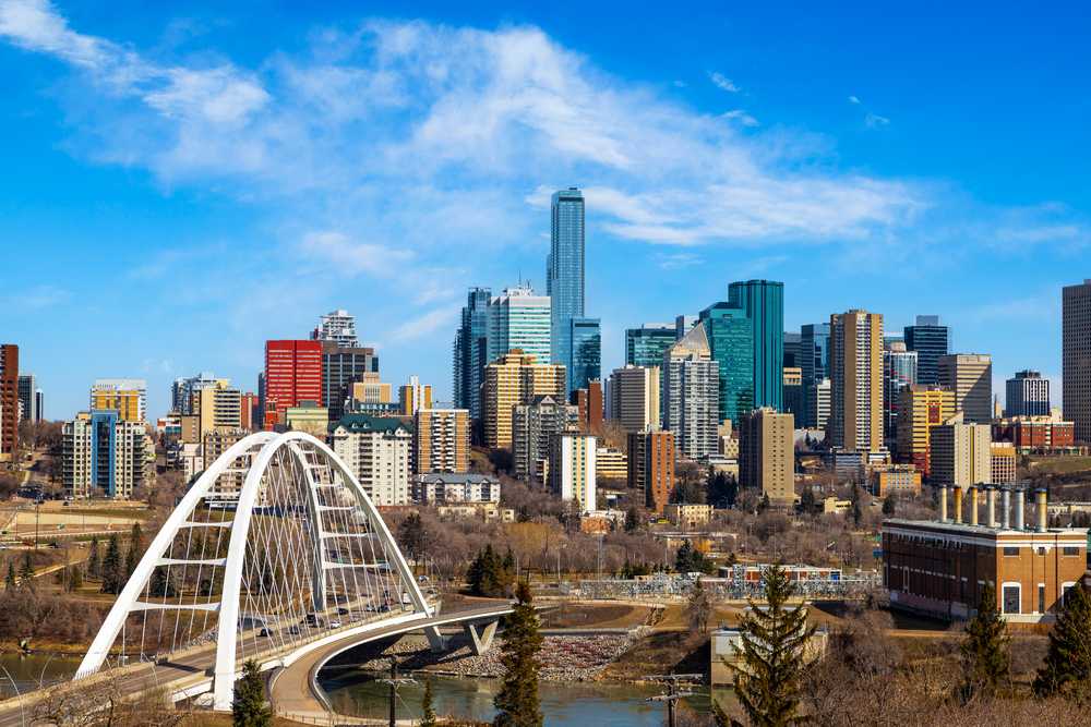 Explore the stunning skyline of Edmonton with a captivating bridge in the background.