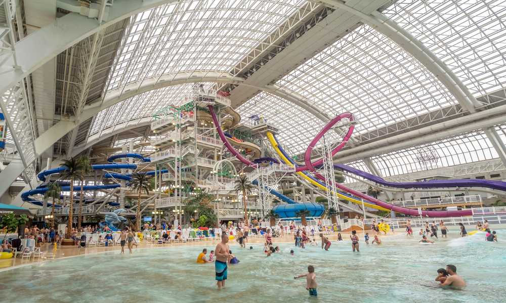 West Edmonton Mall Attractions: The West Edmonton Mall boasts numerous attractions, including a sprawling indoor water park bustling with countless visitors.