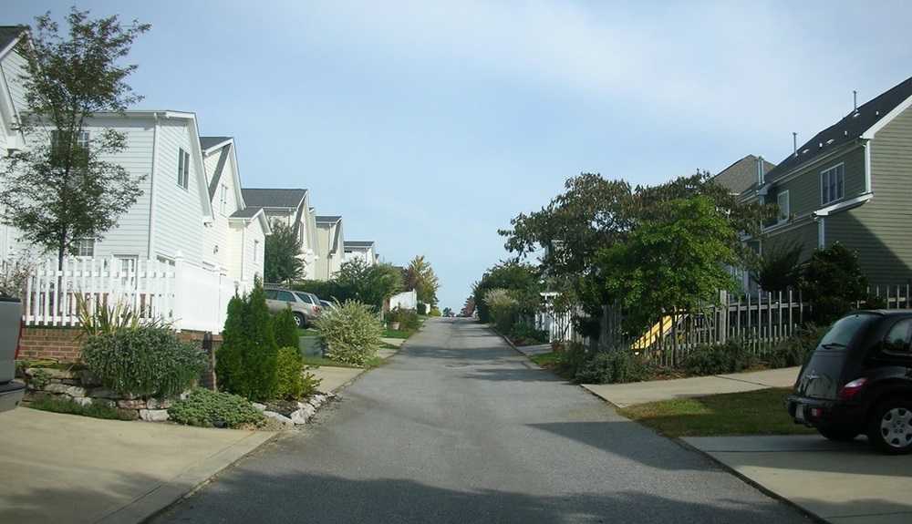 Safest Cities In America: A street with houses and trees in one of the safest cities in America.