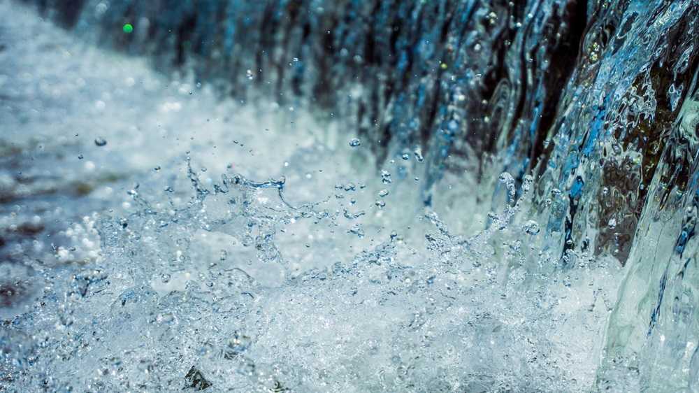 A close up of water splashing over a waterfall in the Canadian Rockies.