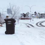 Garbage Bin on the Side on a Snowy Road