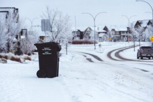 Garbage Bin on the Side on a Snowy Road