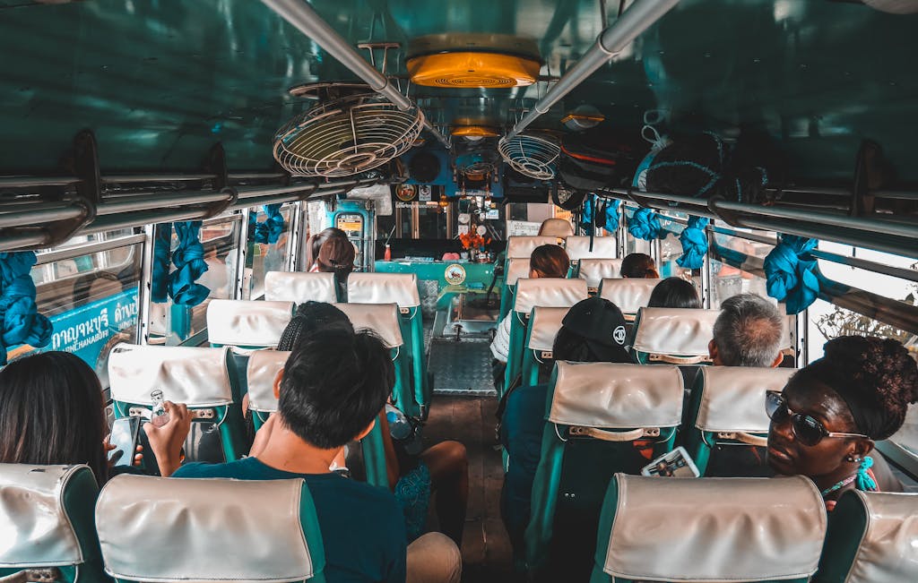 How to travel on a budget: People sitting in a budget bus